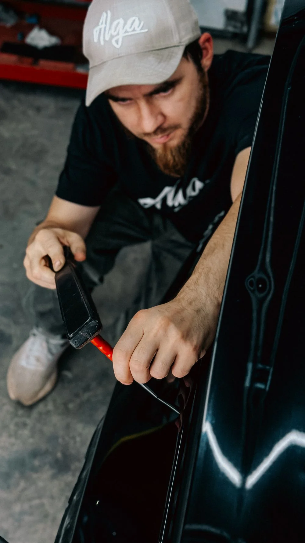 Technician working on fleet vehicle dent repair
